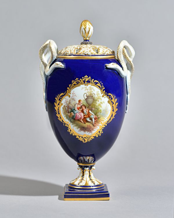 A Meissen porcelain vase and cover, late 19th century, the foliate pierced cover over a cobalt blue and gilt ground , painted with a shepherd and shep