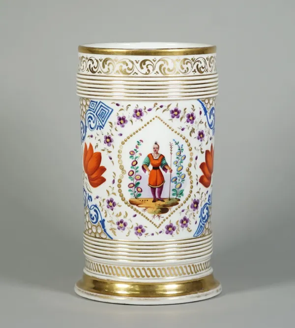 A Paris porcelain cylindrical vase, second half 19th century, painted with two panels enclosing an oriental figure in a landscape against a ground sca