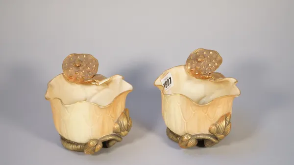 A pair of Royal Worcester blush ivory vases, late 19th century, each of lily pad form with gilt flower and turtle to the rim, printed marks, 10.5cm hi