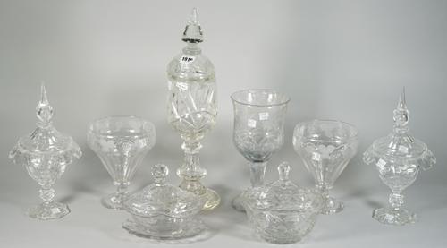 A group of cut glass, early 19th and later, comprising; an oval bowl, cover and stand; an oval bowl and cover; a tall continental goblet and cover, 47