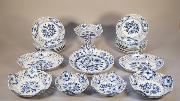 A Meissen 'Onion' pattern dessert service, late 19th century, comprising; a comport, 15.5cm high, two circular pierced dishes, 22cm diameter, two smal