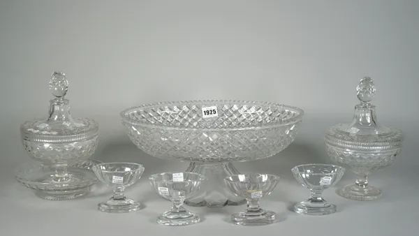 A group of cut glassware, 19th century, comprising; a large oval bowl on spreading foot with scalloped edge, 35.5cm wide; a pair of bowls, covers and