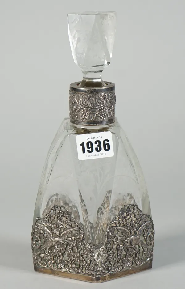 An engraved glass liqueur decanter and stopper with Dutch silver mounts, circa 1930, the glass engraved with fruiting vine, the mounts pierced and dec