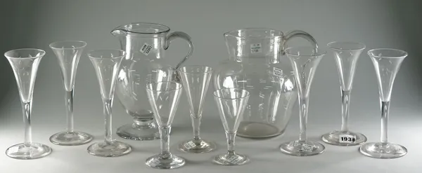 A set of six wine glasses, each with a drawn trumpet bowl, 17.5cm high; three smaller drawn trumpet glasses and two glass jugs, each approx. 20cm high