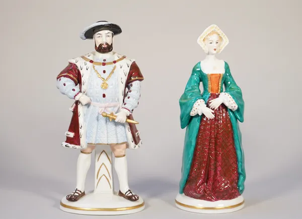 A pair of German porcelain figures and a pair of Dresden figures, 'Flower sellers' and a pair of Dresden porcelain 'Soldier' figures, the tallest 19.5