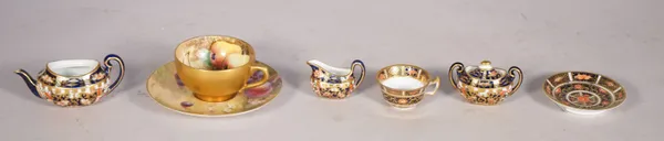 A Royal Worcester fruit painted cabinet cup and saucer, circa 1918, the saucer signed F.Harper, the cup W.Hart, and three Royal Crown Derby Imari mini