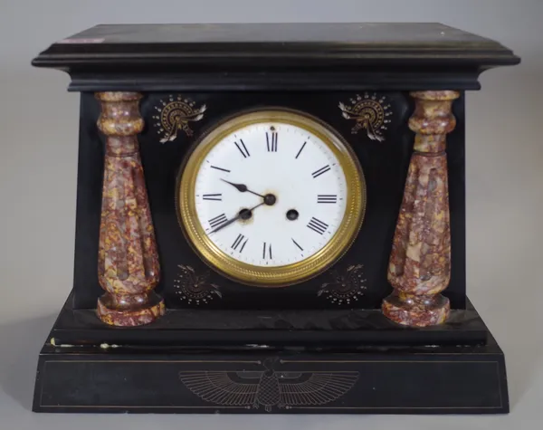 An early 20th century Egyptian Revival black slate cased mantel clock, 35cm wide.