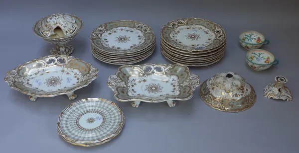 A Davenport porcelain part dessert service, circa 1835, each piece with a central gilt foliate medallion inside an eau de nil border gilt with fruitin