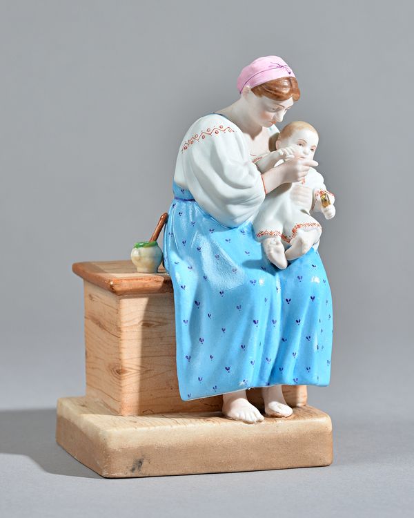 A Russian biscuit porcelain figure of mother and child, Gardner factory, late 19th century, red printed mark, 16.5cm high. Illustrated