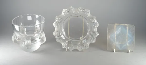 A Lalique clear and frosted glass bowl supported on an 'owl' moulded base, signed 'Lalique France', 13.3cm high, a Lalique dish with moulded rim, 20cm