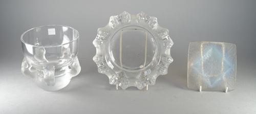 A Lalique clear and frosted glass bowl supported on an 'owl' moulded base, signed 'Lalique France', 13.3cm high, a Lalique dish with moulded rim, 20cm