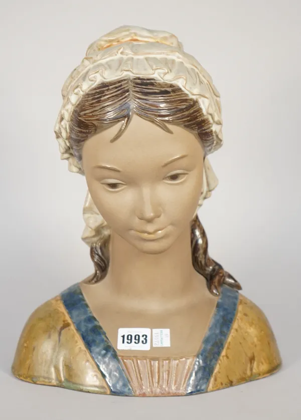 A Lladro matte glaze bust of a young girl, blue printed mark to base, 34cm high.