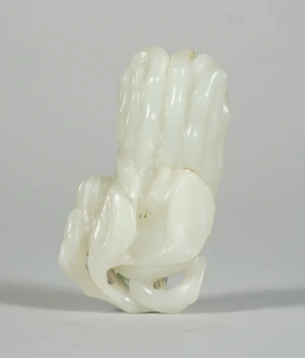 A Chinese pale celadon jade snuff bottle, Qing dynasty, carved as a finger citron, 7cm long.