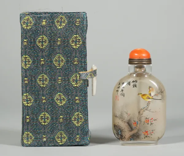 A Chinese inside painted glass snuff bottle, 20th century, each side painted with birds in branches, signed, 5.75cm high, cased.