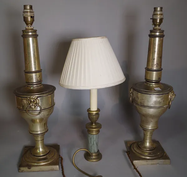 A pair of 20th century silvered metal table lamps with lion mask handles, 51cm high and another smaller 20th century lamp, 38cm high, (3).