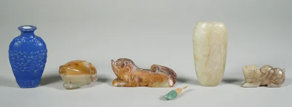 A group of four Chinese jade carvings, comprising; two small recumbent animals, 4cm. and 6cm. length; a snuff bottle in the form of a toad, 4cm. lengt