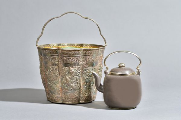 A polished Yixing teapot and cover made for the Thai market, with Thai silver holder, late 19th/20th century, the teapot with silvered-metal mounts, t