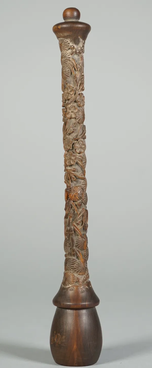 A Chinese rhinoceros horn fly whisk handle, 19th century, carved with bamboo, pine and prunus, 21cm. length. Weight 55.5gms.  Provenance; Christies, L