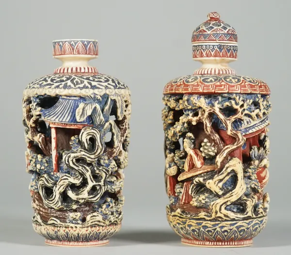 Two Chinese ivory snuff bottles and a stopper, early 20th century, each carved and painted with figures amongst trees, apochryphal Qianlong seal marks