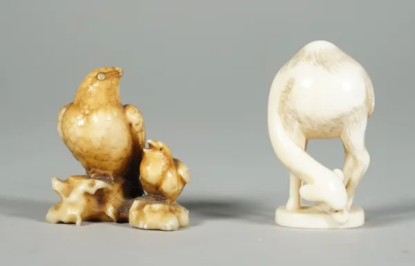 A Japanese ivory netsuke of a hawk and young, Edo period, 19th century, perched side by side, the adult with inlaid mother-of-pearl eyes, signed, 3.5c