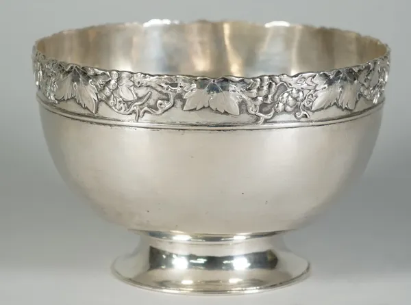 A Chinese export silver bowl, mark of Zeewo, 20th century, circular form on waisted foot, the border applied with fruiting vine and tendrils, marked Z