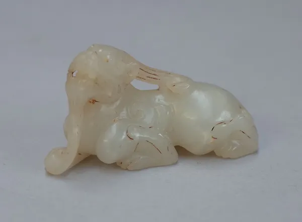 A Chinese small white jade mythical creature, carved in recumbent pose, 5.5cm.length.