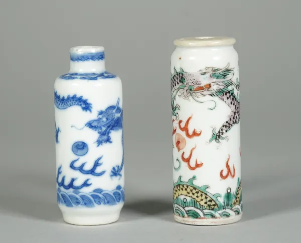 A Chinese famille-verte cylindrical snuff bottle, late 19th/20th century, enamelled with two dragons chasing a flaming pearl, 7.25cm. high; and a blue