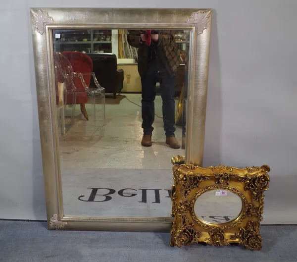 A Regency style gilt framed wall mirror with oval bevelled plate, 39cm wide x 36cm high and a 20th century silver painted recangular wall mirror, 109c