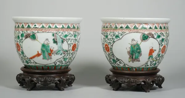 A pair of small Chinese famille-verte jardinieres, circa 1900, each enamelled with panels of a dignatary and attendants alternating with smaller flowe
