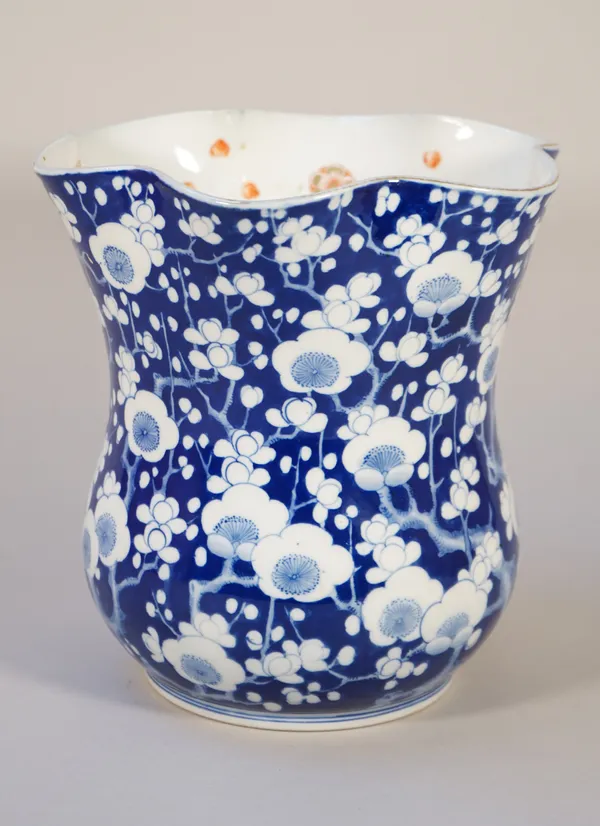A Japanese Fukagawa vase, Meiji/Taisho period, the bulbous body beneath a waisted neck and scalloped rim, painted with branches of flowering prunus ag