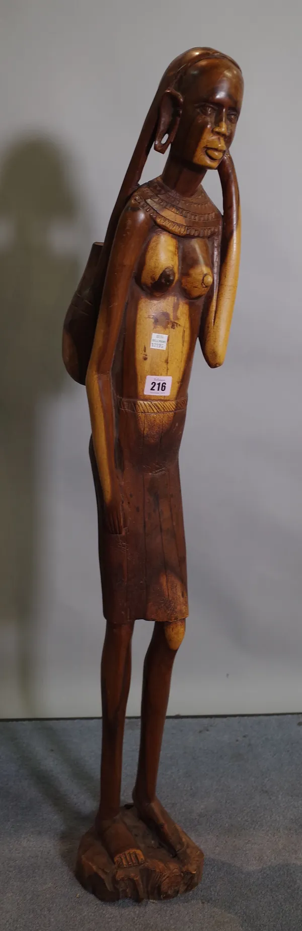 An early 20th century tribal carved African wooden figure.