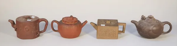 A group of four Chinese Yixing teapots and covers, 19th/20th century, one of melon form with Buddhist lion knop, another moulded with prunus branches,