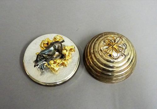 A Stuart Devlin Christmas box, containing a silver and silver gilt model representing the eighth day of Christmas, being Eight Maids a Milking, number