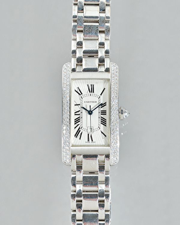 Cartier; a diamond set 18ct white gold Tank Americaine wristwatch, model number 1726, the silvered guilloche dial with Roman Numerals and date apertur