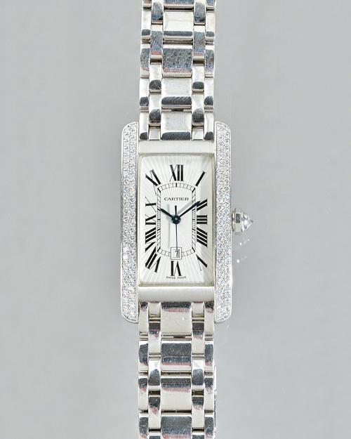 Cartier; a diamond set 18ct white gold Tank Americaine wristwatch, model number 1726, the silvered guilloche dial with Roman Numerals and date apertur