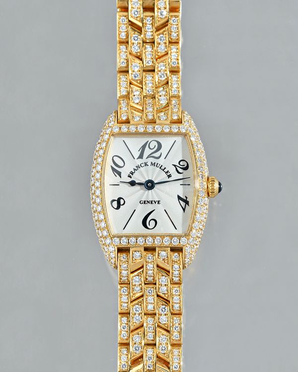 Franck Muller, a lady's diamond set Cintrée Curvex 18ct gold wristwatch, of tonneau shape, the silvered guilloche signed dial, with Arabic numerals an