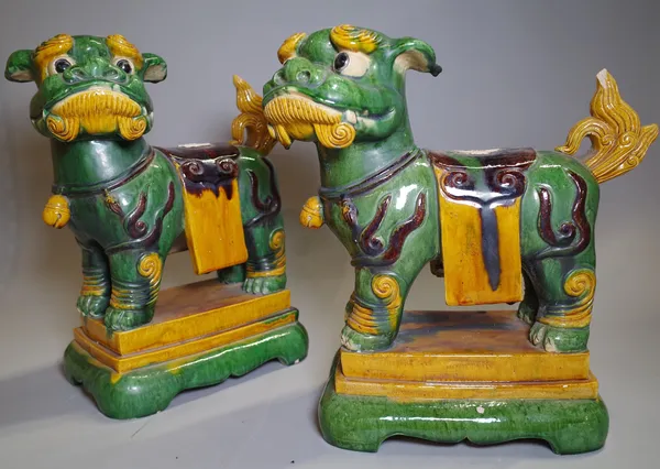 A pair of 20th century Chinese dogs of Fo 35cm wide x 40cm high and a gilt and a giltwood figure of a reclining Buddha, (3).