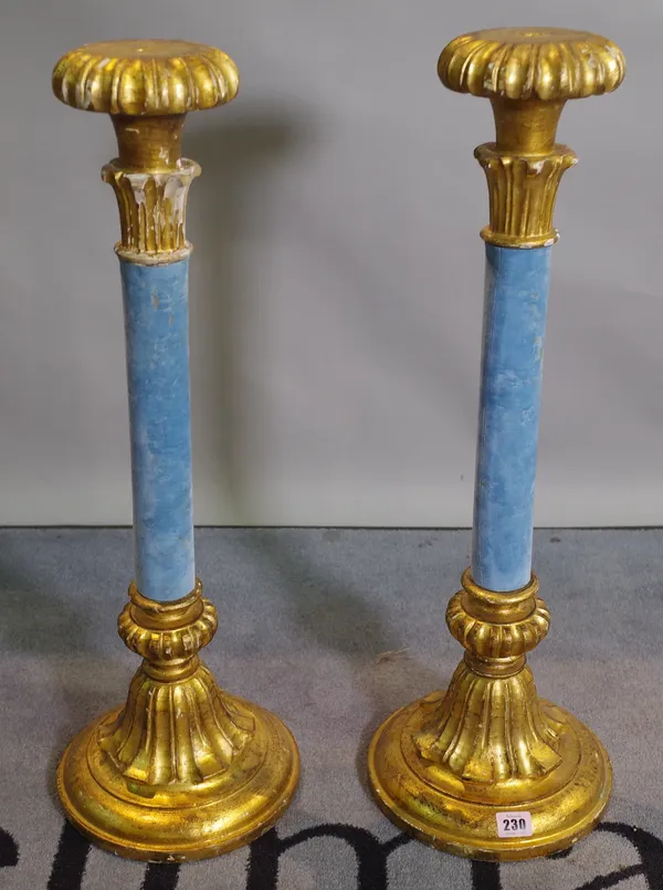 A pair of parcel gilt and blue velvet Rococo Revival candlesticks, 67cm high x 12cm diameter at base, (2).