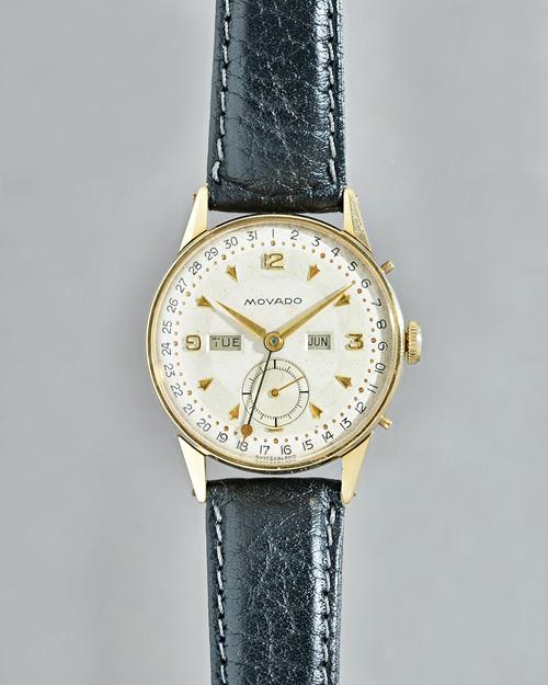 A Movado gold cased gentleman's calendar wristwatch, with a signed jewelled lever movement, the signed silvered dial with gilt Arabic and arrow shaped