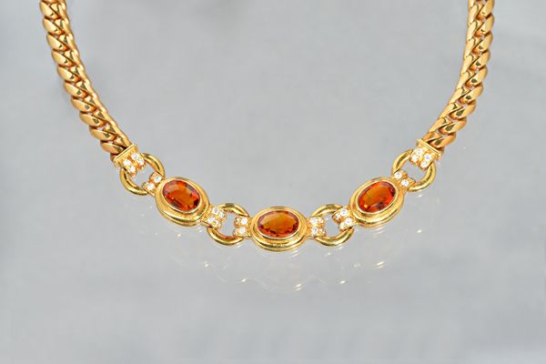 A Bvlgari 18ct gold, citrine and diamond necklace, the front of circular and oval chain link design, collet set with three oval cut citrines and other