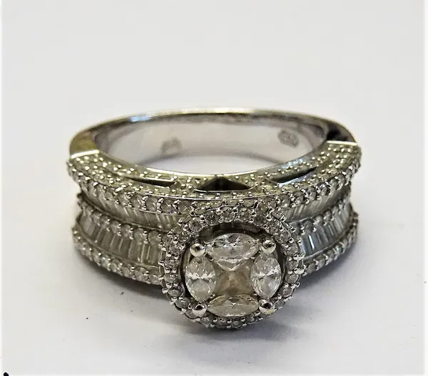 A white gold and diamond cluster ring, mounted with a central square diamond, in a surround of four marquise diamonds, in a border of small circular c