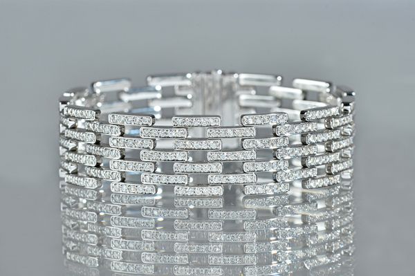 An 18ct white gold and diamond set bracelet, in a multiple row bar link design, mounted with circular cut diamonds, on a snap clasp, length 18cm, gros