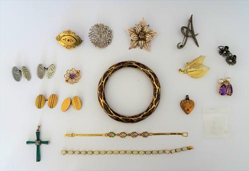 A gold and opal bracelet, mounted with a row of oval opals, on a snap clasp, detailed 585, (one opal lacking), a gilt metal and opal four stone bracel