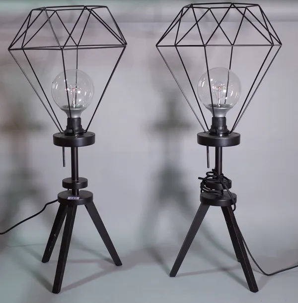 A pair of 20th century black painted tripod lamps with wire work shades, 75cm high, (2).