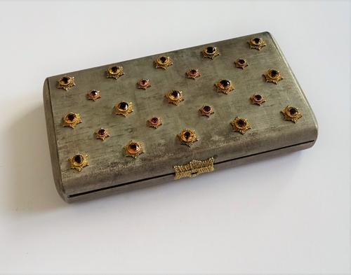 A minaudière by Buccellati, the brushed finished bi-metal case, of rectangular shape, the cover set with citrines and pink tourmaline in yellow metal