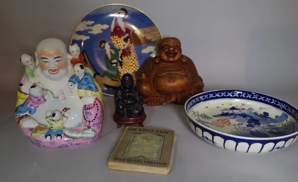 Asian interest, a group of Asian ceramics, including a porcelain Buddah, bowl, a carved hardwood Buddah and sundry.