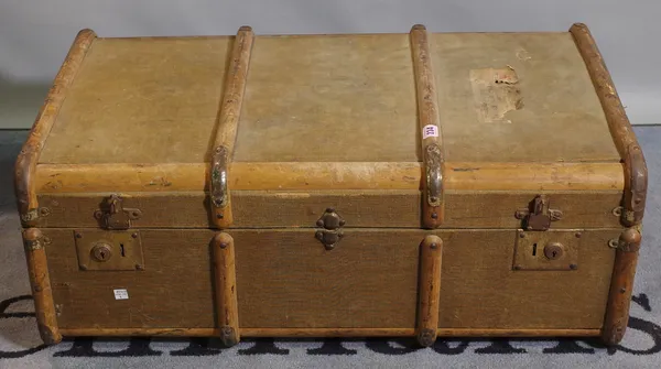 An early 20th century canvas and wood band travelling trunk, 126cm wide.