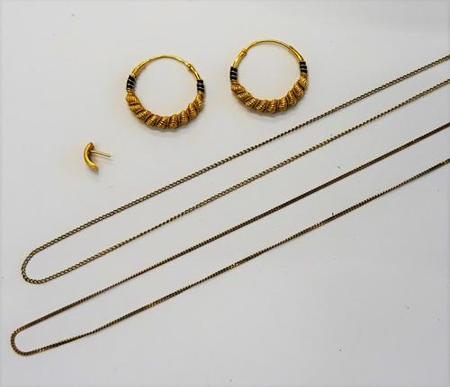 A pair of 22ct gold and black enamelled earrings, each in a decorated circular design of classical style, one odd earring detailed 916, combined gross