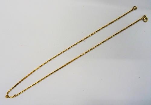 A gold neckchain, in a faceted oval link design, on a boltring clasp, detailed 18 CT, length 44cm, weight 9.4 gms.