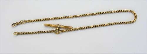 A French gold serpentine link watch Albert chain, fitted with a ridged T bar and with a swivel, gross weight 17.7 gms.